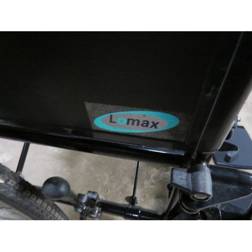 615 - A Lomax self propelled fold away wheel chair