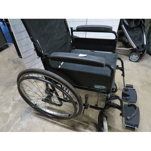 615 - A Lomax self propelled fold away wheel chair