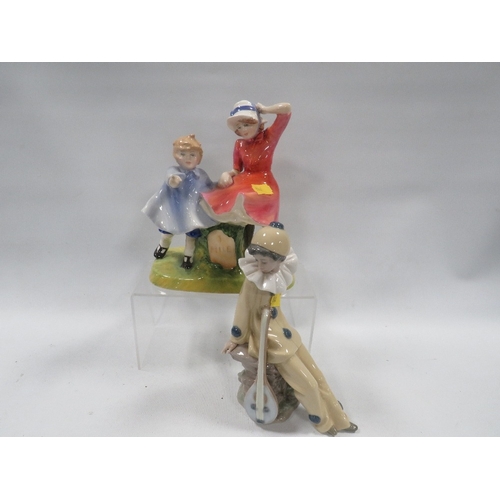 334 - A Royal Doulton figurine 'Milestone' marked as a second A/F together with an Nao figure of a musical... 