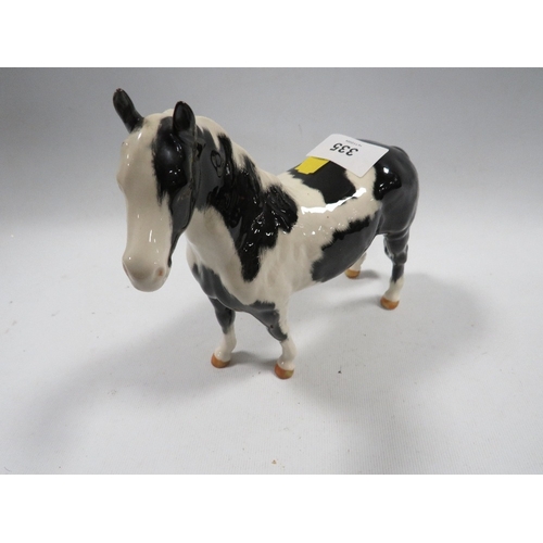 335 - A Beswick piebald horse