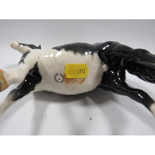 335 - A Beswick piebald horse