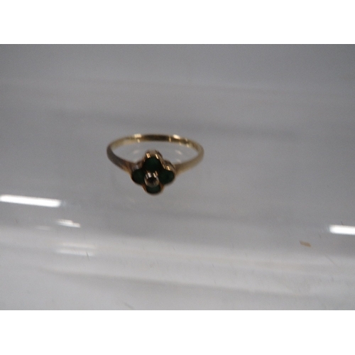 428 - A hallmarked 9 carat gold ring set with emeralds in a four leaf clover setting approx. weight 1.5g