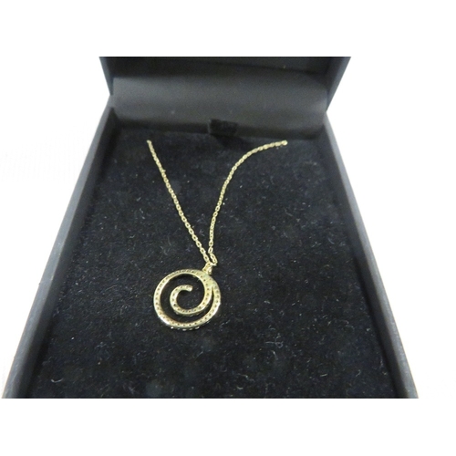 433 - A hallmarked 9 carat gold diamond swirl pendant on chain approx. weight 1.1g