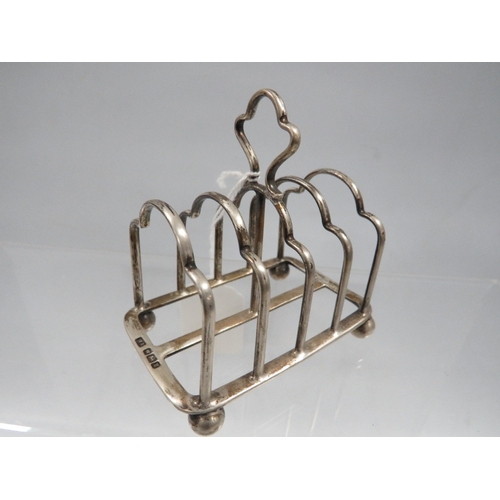 445 - A hallmarked silver four division toast rack