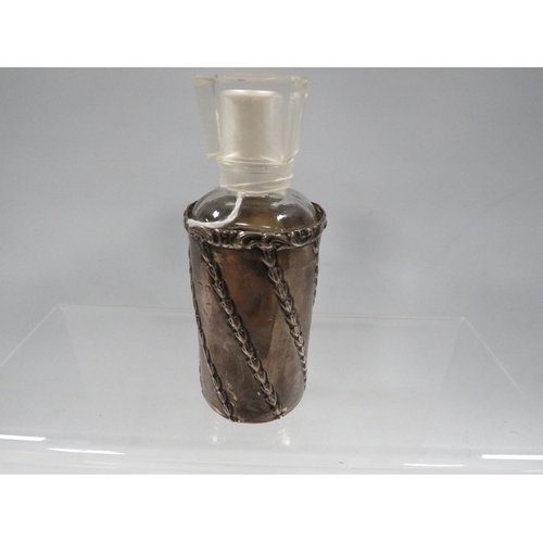 446 - A hallmarked silver bottle sleeve