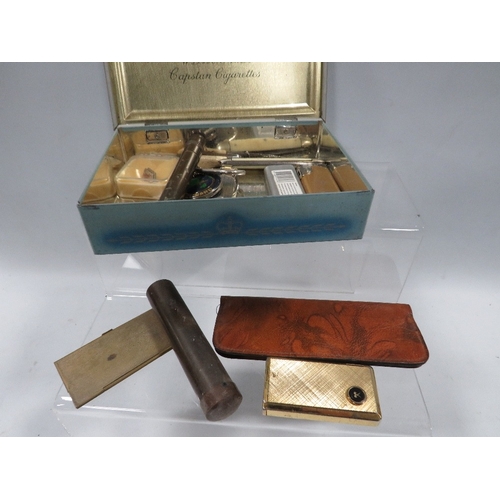 456 - A small tray of collectables to include cigarette lighters, etui case and contents, pocket knives et... 