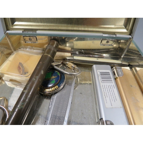 456 - A small tray of collectables to include cigarette lighters, etui case and contents, pocket knives et... 