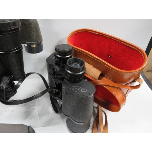 458 - Three assorted pairs of binoculars