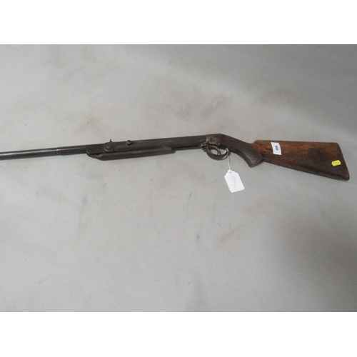 498 - An antique air rifle with chequered grip