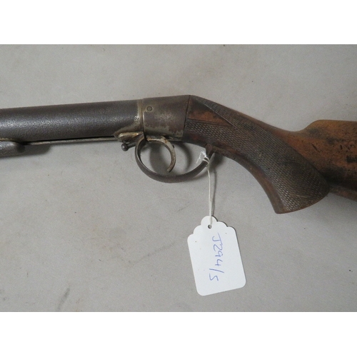 498 - An antique air rifle with chequered grip