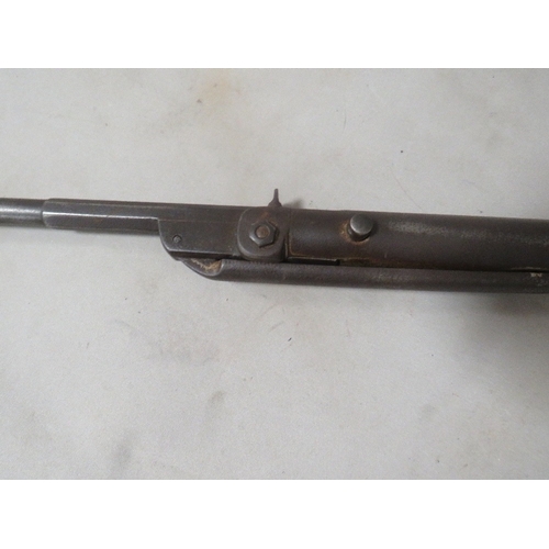 498 - An antique air rifle with chequered grip