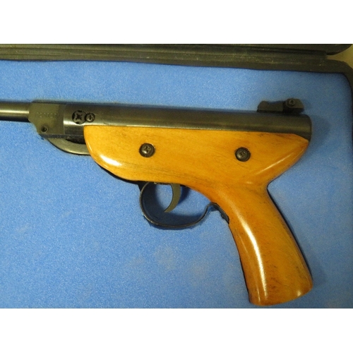 517 - A cased Pioneer air pistol and pellets