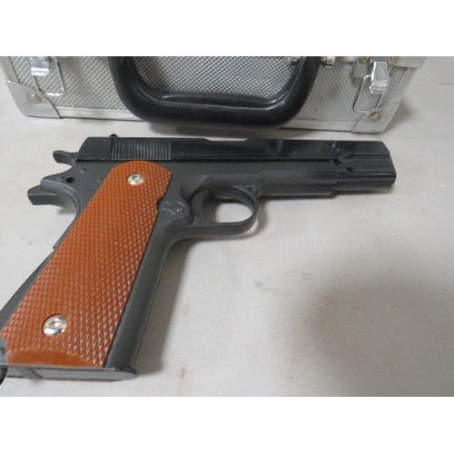 528 - An unmarked air pistol in hard shell case