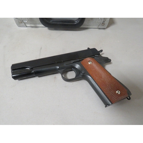 528 - An unmarked air pistol in hard shell case