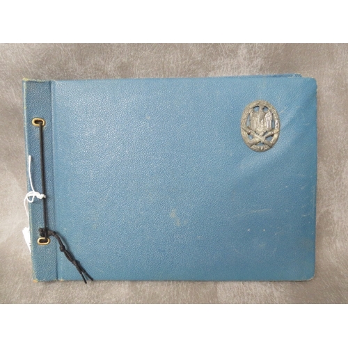 105 - A WW2 MILITARY INTEREST PHOTOGRAPH ALBUM, with general assault badge fixed to front cover, various i... 