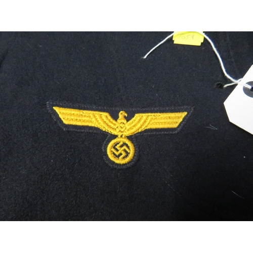 131 - A KRIEGSMARINE TYPE BLUE SHIRT, with cloth eagle badge to right breast, tagged for size 3