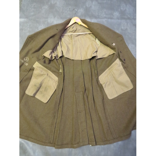 135 - A WW2 BRITISH ARMY GREAT COAT, size 8, dated 1943, buttons for Kings Own Scottish Borders