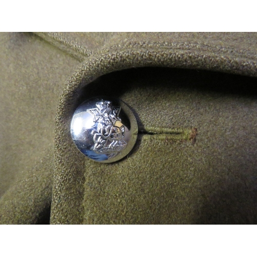 138 - A BRITISH ARMY OFFICERS GREAT COAT, with stay bright buttons