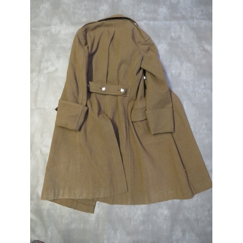 138 - A BRITISH ARMY OFFICERS GREAT COAT, with stay bright buttons