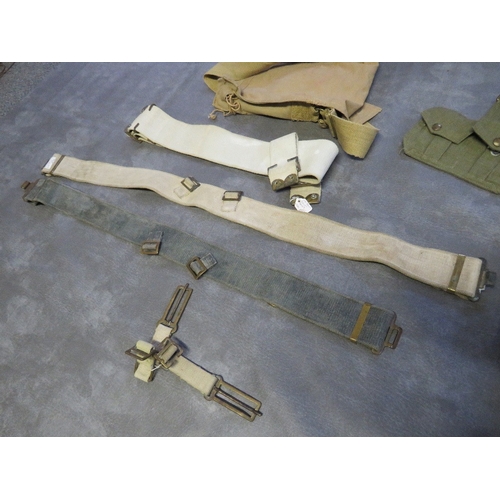 187 - A QUANTITY OF WWII ERA BELTS AND POUCHES ETC., to include a ladies gas mask, hand bag and a 1944 dat... 