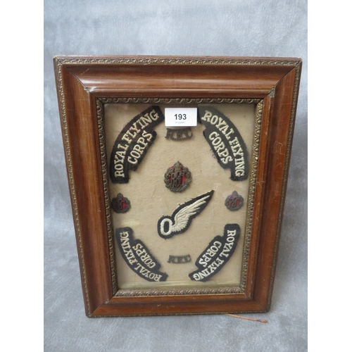 193 - A ROYAL FLYING CORPS BADGE COLLECTION IN FRAME, to include shoulder titles, cap and collar badges an... 