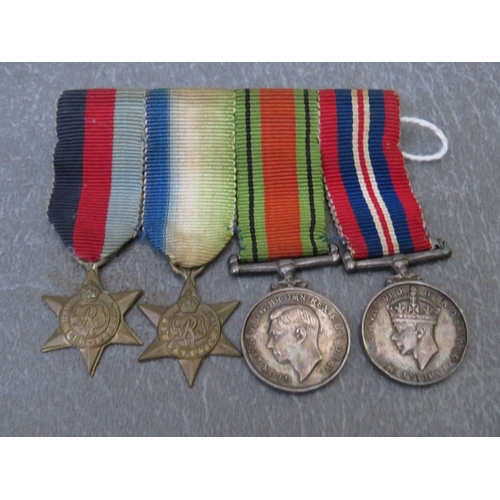 198 - FOUR BARS OF MINIATURE DRESS MEDALS, to include WW2 and NATO types