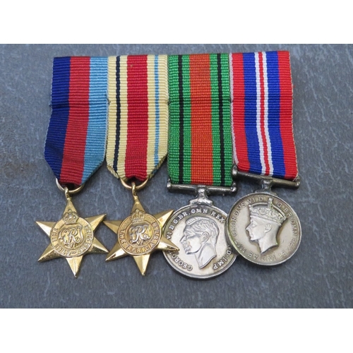 198 - FOUR BARS OF MINIATURE DRESS MEDALS, to include WW2 and NATO types