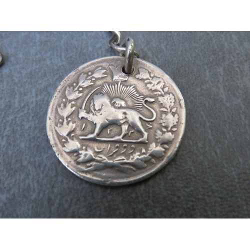 207 - A SILVER POCKET WATCH CHAIN WITH FOB MADE FROM PERSIAN COIN, inscribed H. Procter DC7 North Staffs B... 