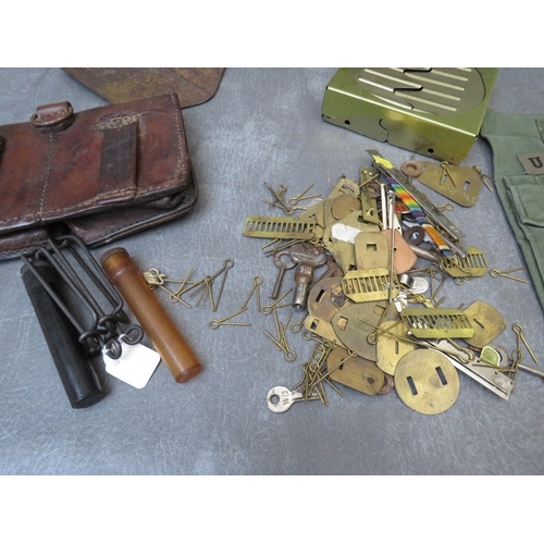 216 - A SMALL BOX OF MILITARY COLLECTABLES, to include cycle lamps, Swedish mag case, various pouches etc.