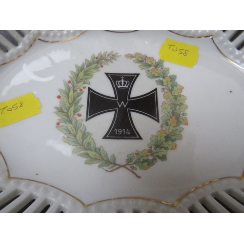 217 - A GERMAN WWI PORCELAIN BASKET, the centre decorated with an iron cross medal in wreath