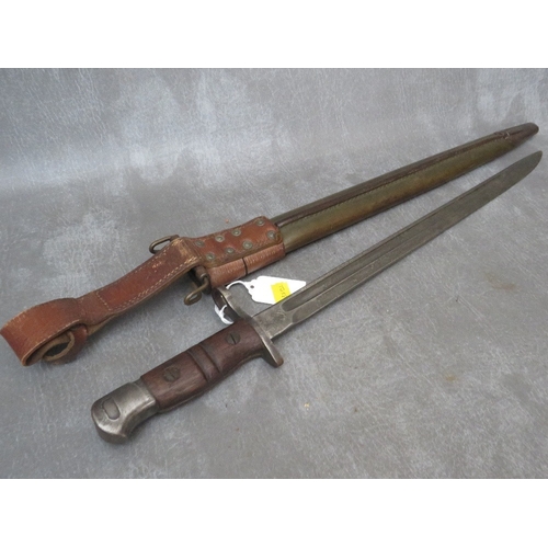 223 - A US WWI BAYONET, in scabbard, with leather frog