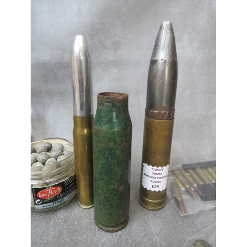 241 - A BOX OF INERT SHELL AND BULLET CASES, to include a 30mm armour piercing round, SA80 rounds in speed... 