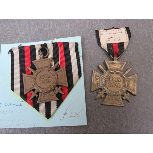 271 - THREE GERMAN 1914-18 CROSS OF HONOUR MEDALS, as war merit medal and a West Wall medal (copy?) (5)