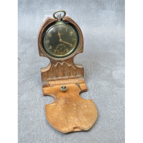 294 - A LEONIDAS GSTP MILITARY POCKET WATCH A/F, marked N1572, in a carved wooden folding stand