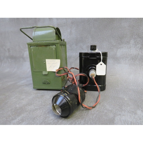 305 - A WWII RESCUE HELMET LAMP, a green painted lantern and a WW2 blackout headlight cover