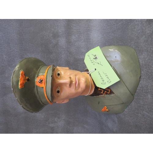 301 - A GERMAN OFFICIAL BUST DESK ORNAMENT AND MILITARY RELATED TOYS, to include lead figures of German so... 