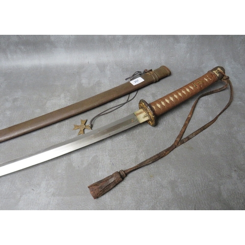 257 - A WW2 JAPANESE KATANA (SWORD), with leather, brass and copper fittings and tsuba, in steel scabbard,... 