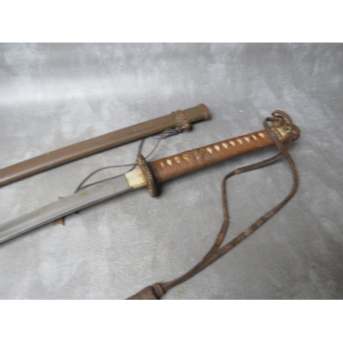 257 - A WW2 JAPANESE KATANA (SWORD), with leather, brass and copper fittings and tsuba, in steel scabbard,... 