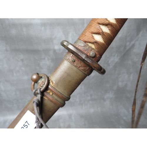 257 - A WW2 JAPANESE KATANA (SWORD), with leather, brass and copper fittings and tsuba, in steel scabbard,... 