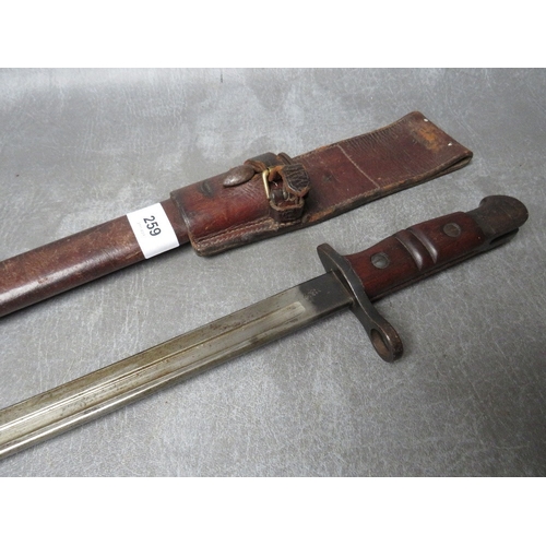 259 - A REMINGTON 1913 BAYONET, with issue mark 3 17, with wooden grooved grip, in scabbard with leather f... 