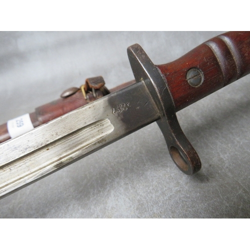 259 - A REMINGTON 1913 BAYONET, with issue mark 3 17, with wooden grooved grip, in scabbard with leather f... 