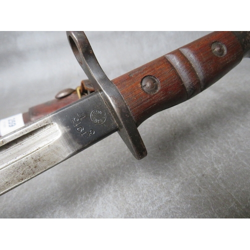 259 - A REMINGTON 1913 BAYONET, with issue mark 3 17, with wooden grooved grip, in scabbard with leather f... 