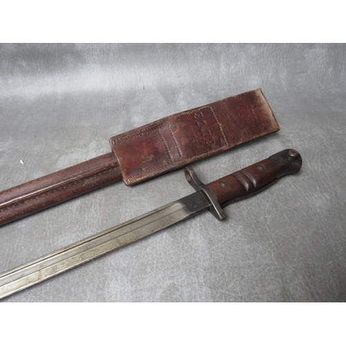 259 - A REMINGTON 1913 BAYONET, with issue mark 3 17, with wooden grooved grip, in scabbard with leather f... 