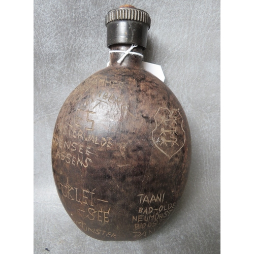 117 - A WW2 GERMAN OAK WATER BOTTLE DATED 1942, hand carved decoration i German / Danish, along with a han... 