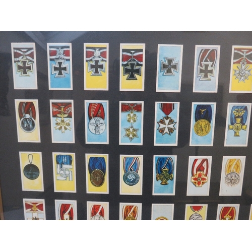 351 - A FRAMED SET OF CIGARETTE CARDS, depicting German WW2 medals and awards, 66 x 55 cm