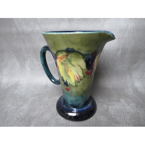 967 - A MOORCROFT LEAF AND BERRY PATTERN EWER, impressed marks to the base, H 15.5 cm