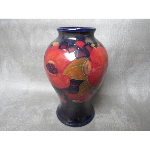 968 - A MOORCROFT POMEGRANATE PATTERN BALUSTER VASE, impressed marks to base, H 16 cm