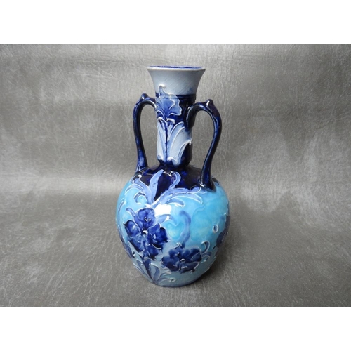 972 - A MOORCROFT FOR MACINTYRE & Co FLORIANWARE TWIN-HANDLED VASE, circa 1900, with impressed and printed... 