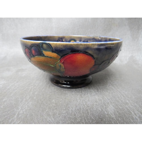 973 - A WILLIAM MOORCROFT POMEGRANATE CIRCULAR BOWL, marks to the base, Dia. 13 cm, S/D