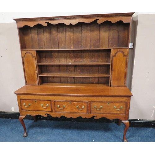 1177 - A 19TH CENTURY OAK COUNTRY DRESSER, having an enclosed plate rack with two crossbanded cupboards, ab... 